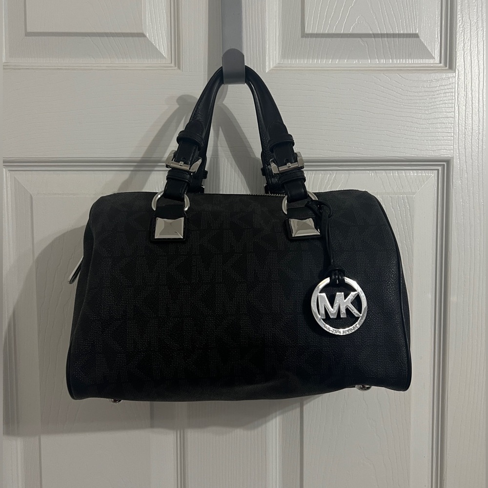 Gently used authentic Michael Kors Black bag with Silver Accents